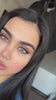 Iconic ice blue lenses on dark brown eyes